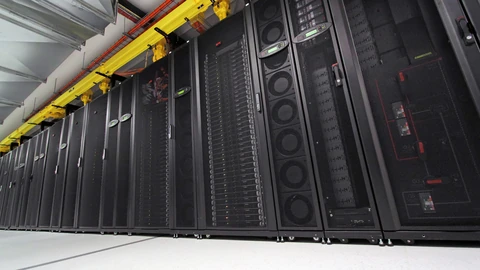 A dense row of computer servers in a rack with visible cabling. No people appear.