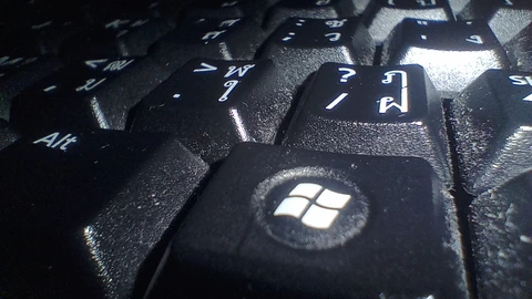 Close-up of black keyboard keys including the Windows and Alt keys. No people appear.