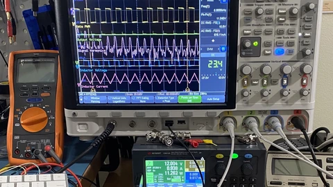 A Keysight digital oscilloscope, multimeter, and power supply on a lab bench. No people appear.