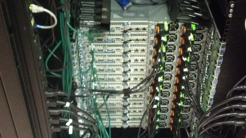 Wikimedia server racks in a data-center row. No people appear.
