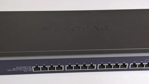 A black Netgear 16-port 10-gigabit switch on a white background. No people appear.