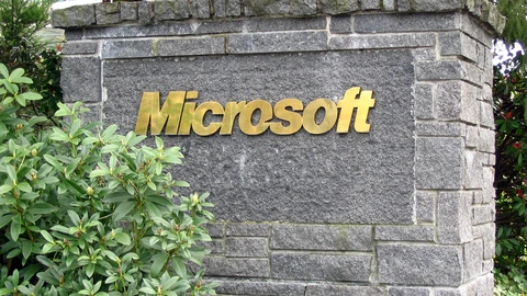 Close-up of a stone Microsoft logo sign at a Redmond campus entrance. No people appear.