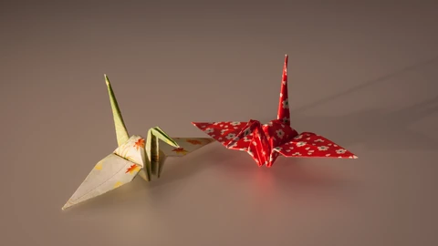 A cluster of multicolored origami paper cranes. No people appear.