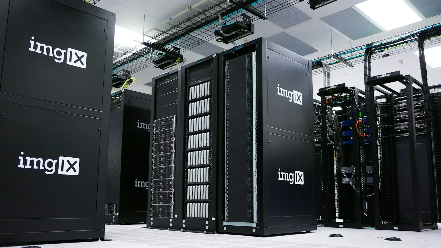 Rows of black server racks in a data centre.