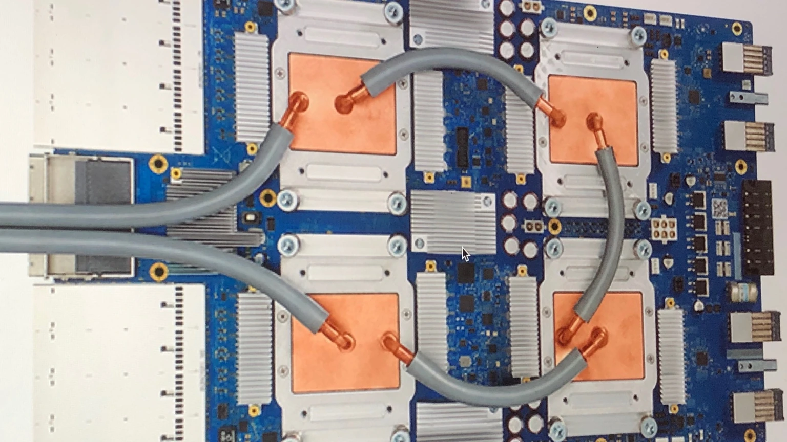 A Google Tensor Processing Unit 3.0 accelerator board on a dark surface. No people appear.