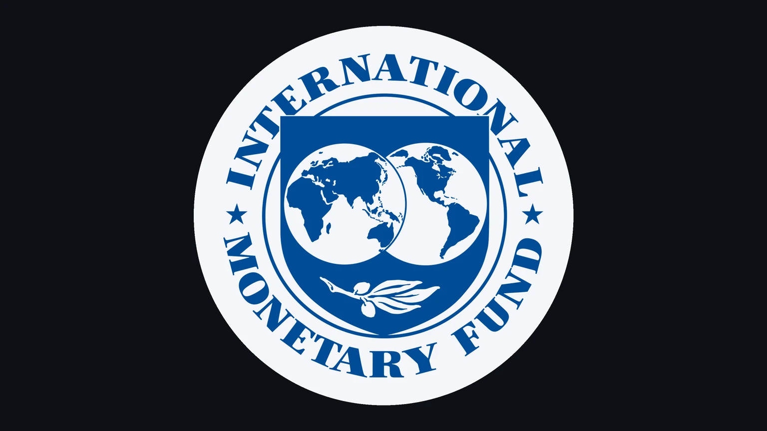 The blue seal of the International Monetary Fund, two globes inside a shield with an olive branch and the words International Monetary Fund around the rim, on a pale disc against a near-black background.
