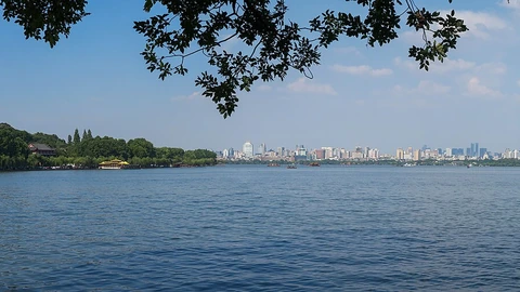 Hangzhou city skyline viewed across West Lake.