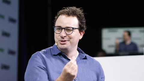 Dario Amodei seated onstage at TechCrunch Disrupt in 2023.