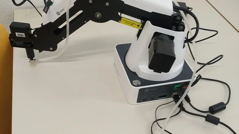 Dobot Magician robotic arm in a robotics laboratory.