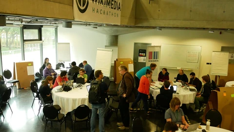 Participants working on laptops in the Wikimedia Hackathon Prague coding room.