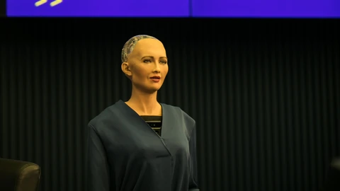 Sophia the robot onstage below the AI for Good Global Summit screen.