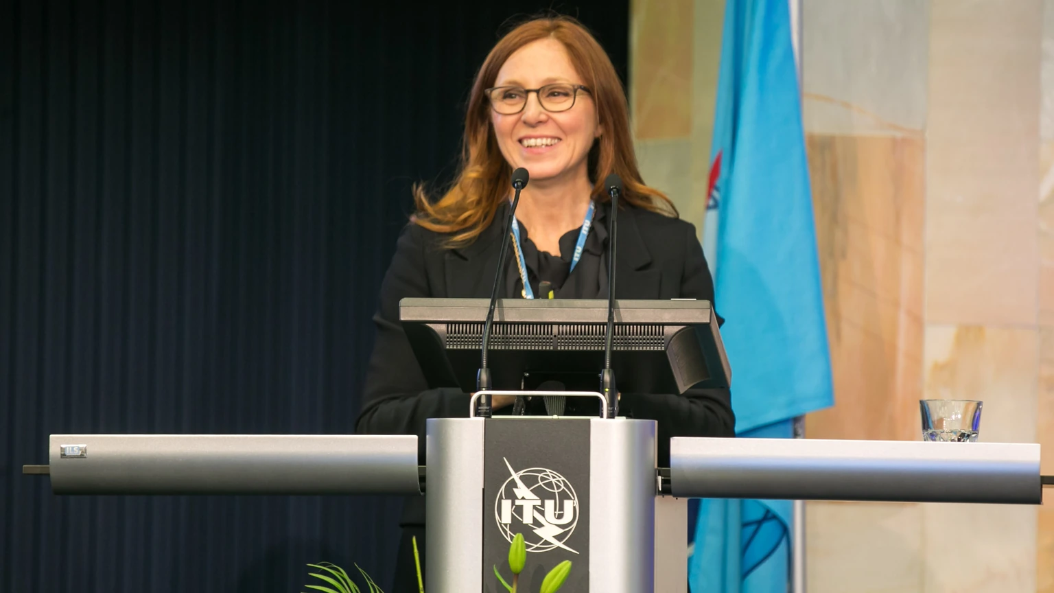Francesca Rossi speaking at a podium at AI for Good.