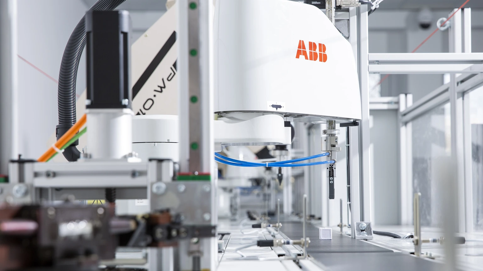 An ABB industrial robotic arm in a manufacturing laboratory.