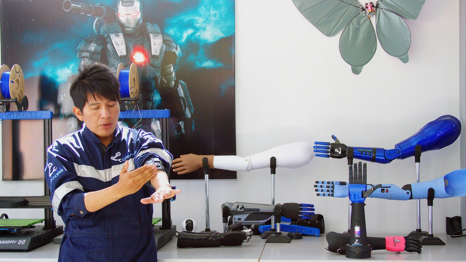 Roly Ronald Mamani,  founder of Robotics Creators Bolivia, demonstrates a robotic upper-limb prosthesis at the Robotics Creators laboratory in Achocalla, La Paz Department, Bolivia.