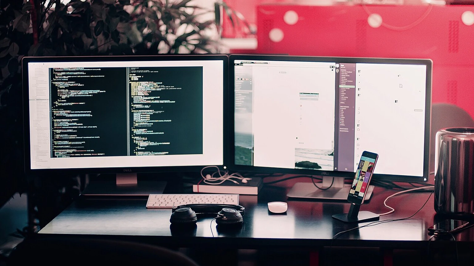 A coding workstation with multiple computer displays.