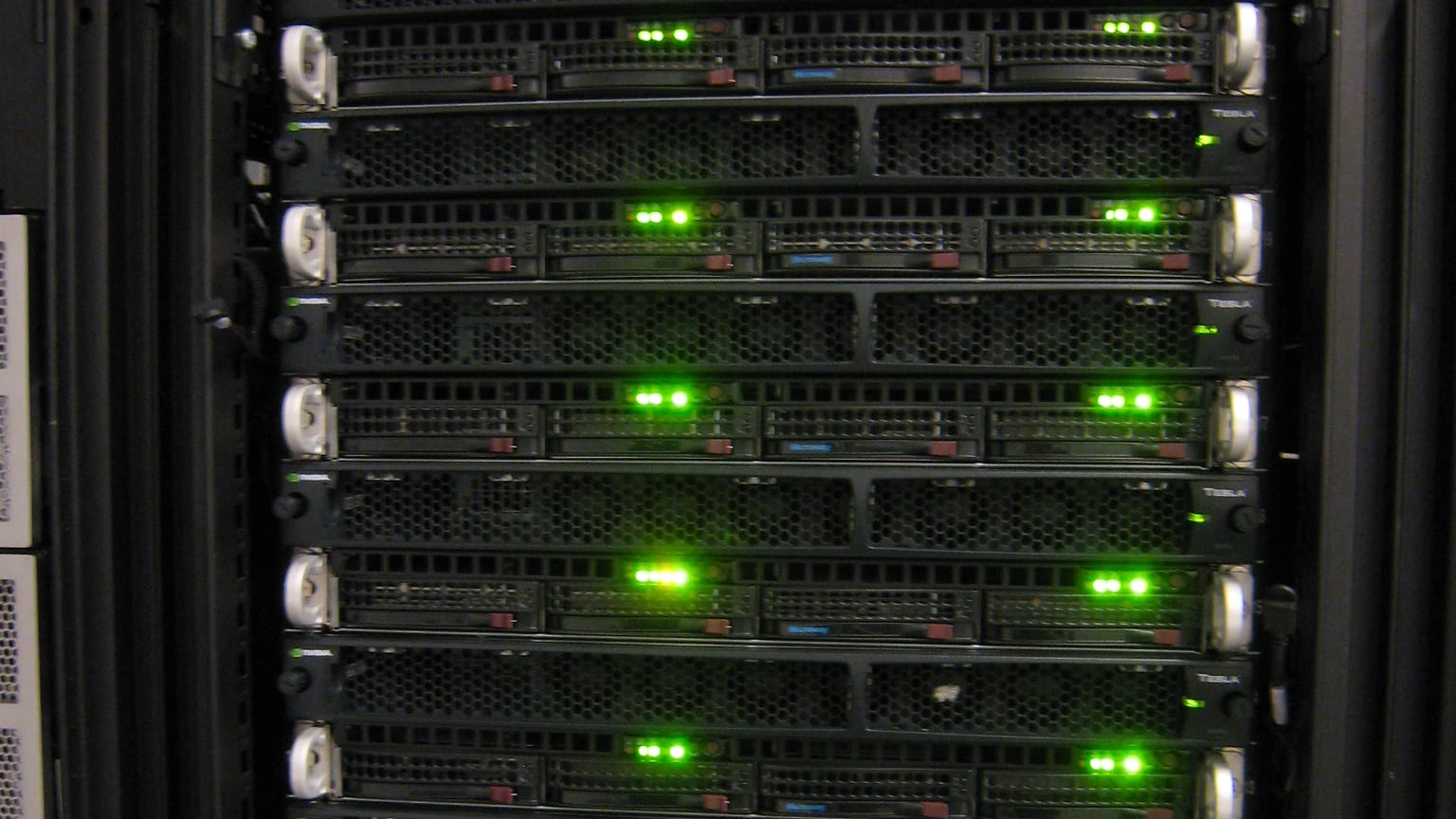 NVIDIA Tesla GPU computing equipment with green status lights.