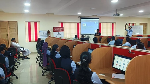 Students and instructors at a Wikimedia technical workshop in a computer classroom.