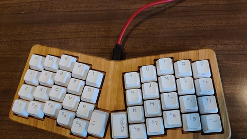 Atreus 42 mechanical keyboard on a desk.