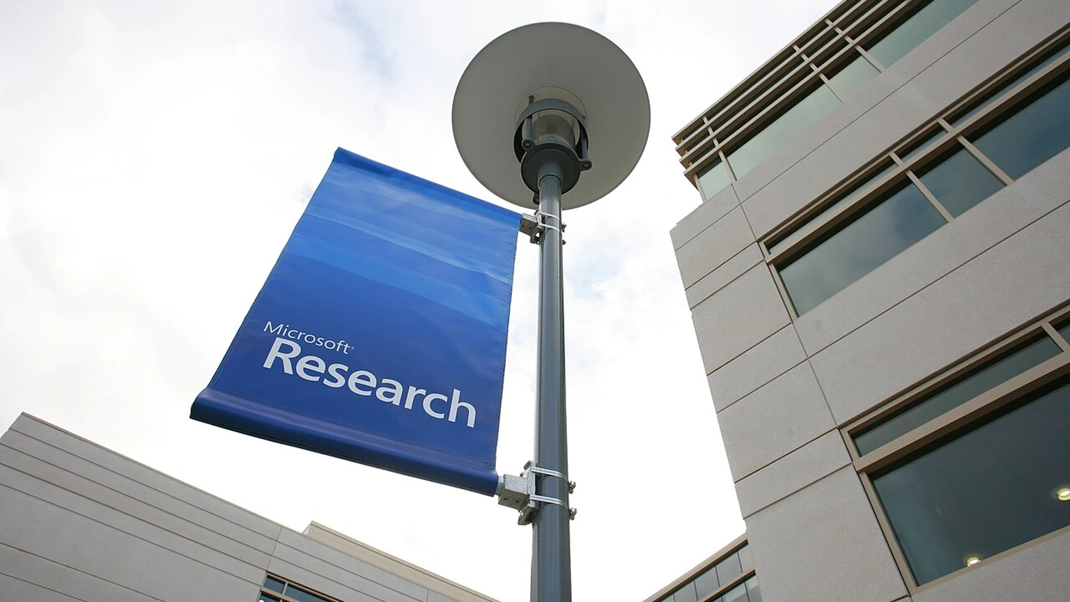 Blue Microsoft Research banner beside the Redmond research building.