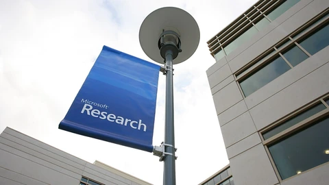 Blue Microsoft Research banner beside the Redmond research building.